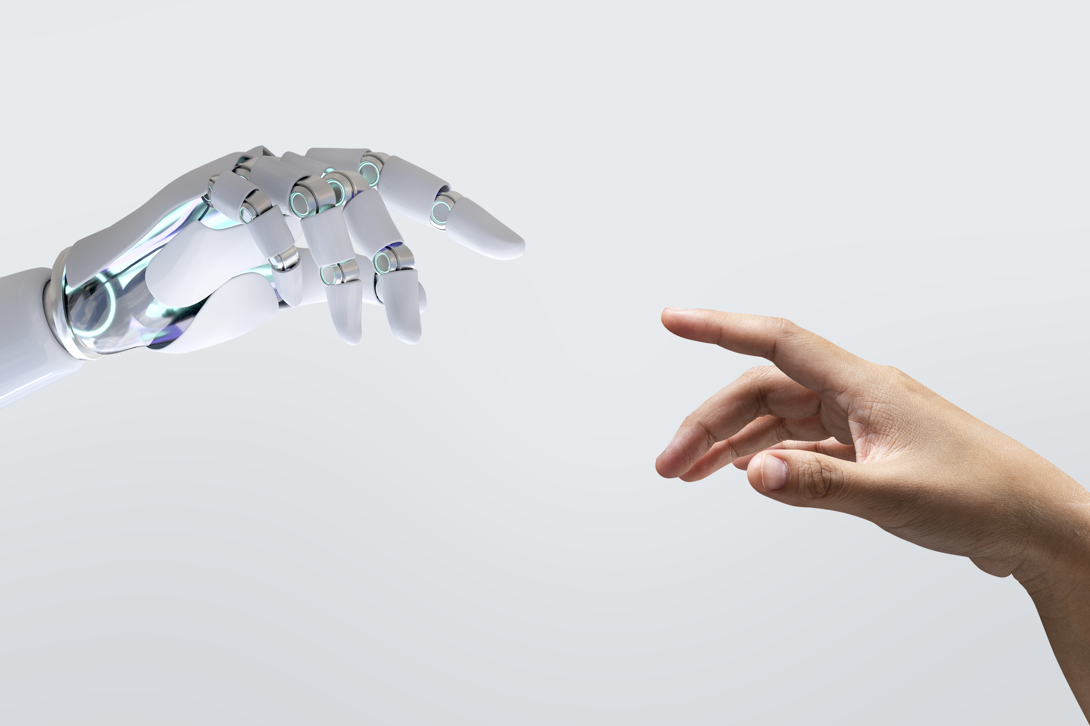 Imagen que muestra una mano humana y una mano de robot representando la integración de la tecnología y la digitalización en la prevención de riesgos laborales.